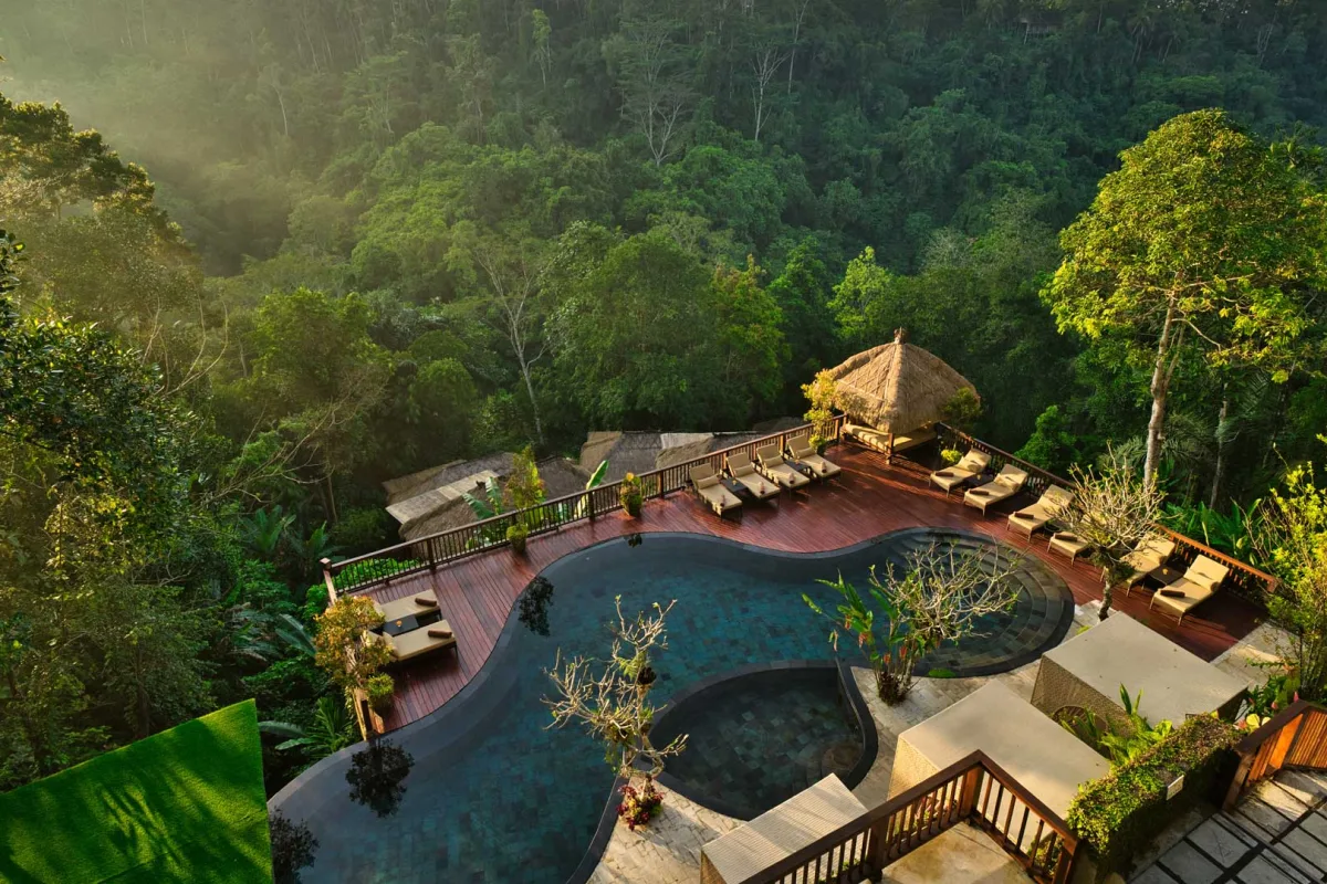 Jungle swimming pool and luxury villas at Nandini Jungle by Hanging Gardens in Ubud Bali.